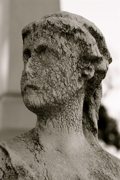 A worn down marble statue at Laurel Hill Cemetery in Philadelphia